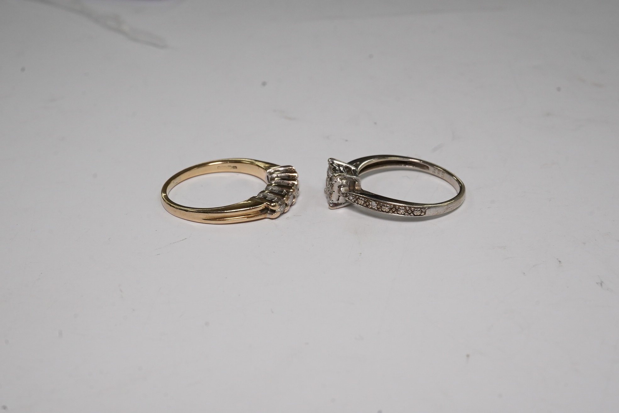 Two modern 9ct gold and diamond set rings, including square cluster and five stone half hoop, gross weight 4.2 grams.